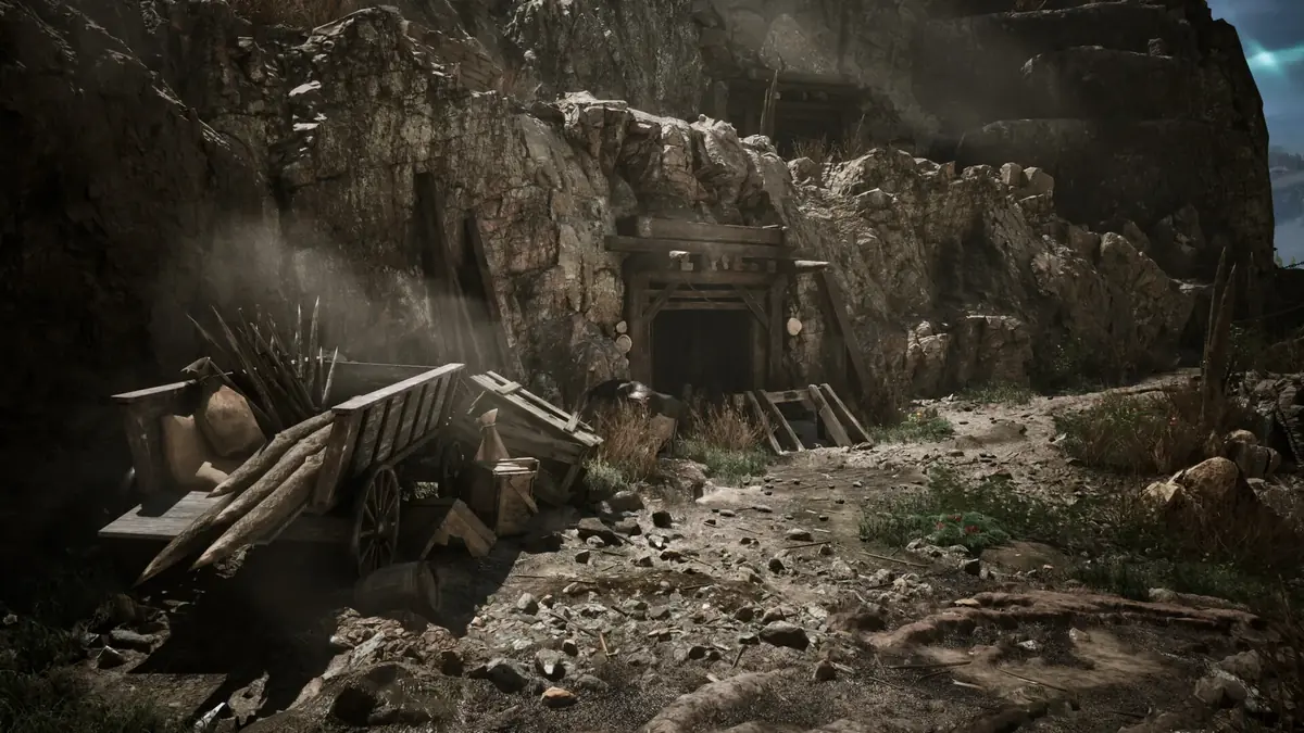 Ein steiniger Pfad führt zu einem hölzern abgestützten Mineneingang in einem offiziellen Screenshot der Gothic 1 Remake Demo